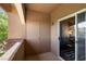 Outdoor patio features an exterior door and sliding glass doors with living room view at 231 W Horizon Ridge Pkwy # 1228, Henderson, NV 89012