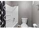 Bathroom with a shower-tub combo with a black and white shower curtain at 231 W Horizon Ridge Pkwy # 1228, Henderson, NV 89012