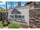 Stone community sign for Big Horn at Black Mountain with desert landscaping at 231 W Horizon Ridge Pkwy # 1228, Henderson, NV 89012