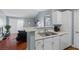 Contemporary kitchen with white cabinetry and appliances offering seamless integration with the living space at 231 W Horizon Ridge Pkwy # 1228, Henderson, NV 89012