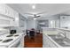 Bright kitchen with white appliances and cabinetry overlooking the dining area, perfect for entertaining at 231 W Horizon Ridge Pkwy # 1228, Henderson, NV 89012