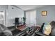 Comfortable living room with dark leather sofas and decorative pillows, and a view of hardwood flooring at 231 W Horizon Ridge Pkwy # 1228, Henderson, NV 89012