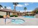 Community pool and hot tub with seating, landscaping, and building in the background at 231 W Horizon Ridge Pkwy # 1228, Henderson, NV 89012