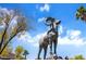 Outdoor statue of a bighorn sheep set against a blue sky with trees and greenery in the background at 231 W Horizon Ridge Pkwy # 1228, Henderson, NV 89012