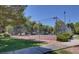 Community tennis court surrounded by lush greenery and well-maintained landscaping at 231 W Horizon Ridge Pkwy # 1228, Henderson, NV 89012