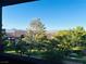 Scenic view from the balcony overlooking lush greenery, mountains, and blue sky at 231 W Horizon Ridge Pkwy # 1228, Henderson, NV 89012