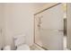 Clean bathroom featuring a toilet and shower with glass doors and grab bar at 2520 Palmridge Dr, Las Vegas, NV 89134