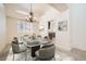 Elegant dining room featuring a modern glass table with seating for six and stylish decor at 2520 Palmridge Dr, Las Vegas, NV 89134
