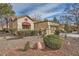 Charming home with well-maintained landscaping, a red-tile roof, and a two-car attached garage at 2520 Palmridge Dr, Las Vegas, NV 89134
