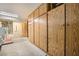 Spacious garage featuring ample built-in wooden storage cabinets and adjacent laundry area with washer and dryer at 2520 Palmridge Dr, Las Vegas, NV 89134