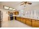 Open kitchen with stainless steel appliances, granite counters, and a large window at 2520 Palmridge Dr, Las Vegas, NV 89134