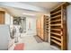 Utility room with washer, dryer, built in shelves, and pegboard at 2520 Palmridge Dr, Las Vegas, NV 89134