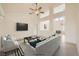 Staged living room with high ceilings, clerestory windows, and stylish furnishings at 2520 Palmridge Dr, Las Vegas, NV 89134