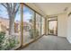 Enclosed sunroom with large windows offering scenic backyard views at 2520 Palmridge Dr, Las Vegas, NV 89134