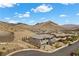 Aerial view of a modern home in a desert community, showcasing its premium location and landscaping at 2601 Nevada Agave Ln, Las Vegas, NV 89138