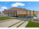 Stunning backyard featuring a modern pool, inviting lounge space, desert landscaping, and mountain views at 2601 Nevada Agave Ln, Las Vegas, NV 89138