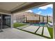 Inviting outdoor living space featuring a modern pool, turf, mountain views, and desert landscaping at 2601 Nevada Agave Ln, Las Vegas, NV 89138