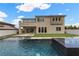 Inviting backyard pool with water features, well-manicured lawn, and contemporary home design at 2601 Nevada Agave Ln, Las Vegas, NV 89138