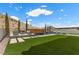 Backyard oasis with pool, lounge area, green turf, mature landscaping, and mountain views at 2601 Nevada Agave Ln, Las Vegas, NV 89138