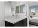 Bright bathroom with a sleek vanity and a view into the bedroom at 2601 Nevada Agave Ln, Las Vegas, NV 89138