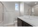 Bathroom featuring a sleek vanity with a frameless mirror and a glass-enclosed shower at 2601 Nevada Agave Ln, Las Vegas, NV 89138