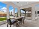 Bright dining area with views of the outdoor fireplace and blue skies at 2601 Nevada Agave Ln, Las Vegas, NV 89138