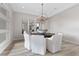 Modern dining room showcasing bright lighting, seating for eight, and reflective decor at 2601 Nevada Agave Ln, Las Vegas, NV 89138