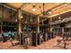 Well-equipped fitness center featuring state-of-the-art equipment, large windows, and a view of the pool area at 2601 Nevada Agave Ln, Las Vegas, NV 89138