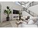 Inviting living room with a sleek fireplace, modern decor, comfortable seating, and natural light at 2601 Nevada Agave Ln, Las Vegas, NV 89138