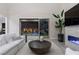 Bright living room with high ceilings, modern fireplace, and access to the backyard at 2601 Nevada Agave Ln, Las Vegas, NV 89138