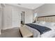 Bright main bedroom boasts neutral colors, plush carpet, and a comfortable seating bench at 2601 Nevada Agave Ln, Las Vegas, NV 89138