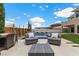 Inviting outdoor patio with comfortable seating, perfect for relaxation with a view of the pool and landscaped backyard at 2601 Nevada Agave Ln, Las Vegas, NV 89138