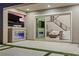 This home boasts a covered patio with an outdoor fireplace and views into the spacious living room at 2601 Nevada Agave Ln, Las Vegas, NV 89138