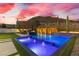 Backyard with pool, spa, tall trees, desert landscaping, and mountain views at 2601 Nevada Agave Ln, Las Vegas, NV 89138