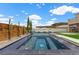Backyard pool area showcasing a tranquil pool, spa, and tasteful landscaping, creating a serene outdoor oasis at 2601 Nevada Agave Ln, Las Vegas, NV 89138
