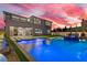 Twilight shot of backyard oasis with pool, spa, and multiple access points to the home at 2601 Nevada Agave Ln, Las Vegas, NV 89138