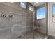 Modern glass shower with dual shower heads and mountain views at 2601 Nevada Agave Ln, Las Vegas, NV 89138