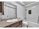 Well-lit bathroom with modern fixtures, granite counters, and a shower-tub combination at 2749 Heritage Cir, Las Vegas, NV 89121