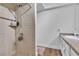 Bright bathroom featuring tiled walk-in shower, modern fixtures, and neutral color palette at 2749 Heritage Cir, Las Vegas, NV 89121