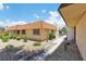 Well-maintained exterior with a low-maintenance landscape and a welcoming facade in a tidy neighborhood at 2749 Heritage Cir, Las Vegas, NV 89121