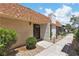 Charming home featuring a striking brick chimney and a welcoming front door and manicured landscaping at 2749 Heritage Cir, Las Vegas, NV 89121