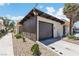 Attached garage with mature trees and low-maintenance landscaping with additional driveway parking at 2749 Heritage Cir, Las Vegas, NV 89121