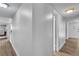 Spacious hallway showcasing light wood floors, fresh paint, and inviting entrance at 2749 Heritage Cir, Las Vegas, NV 89121