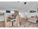 Combined living and dining area with stone accents and new flooring, perfect for entertaining at 2749 Heritage Cir, Las Vegas, NV 89121