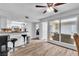 Spacious living area featuring sleek flooring, a breakfast bar, and seamless indoor-outdoor flow at 2749 Heritage Cir, Las Vegas, NV 89121