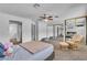 Primary bedroom offers ceiling fan, plush carpet, and sliding mirrored closet doors at 2749 Heritage Cir, Las Vegas, NV 89121