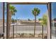 Enjoy serene views from the balcony, framed by palm trees and neighborhood scenery at 2761 Red Vista Ct, Henderson, NV 89074