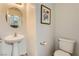 Powder room with pedestal sink and toilet at 2761 Red Vista Ct, Henderson, NV 89074