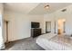 Neutral-toned bedroom featuring a large TV and a dresser at 2761 Red Vista Ct, Henderson, NV 89074
