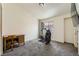 Bedroom with carpet flooring, a window with curtains, and a desk with chair at 2761 Red Vista Ct, Henderson, NV 89074
